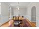Bright dining room features large windows and a wood dining table with seating for eight at 3510 Middlebrook Dr, Durham, NC 27705