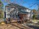 A spacious two-story home with a large deck and a well-maintained lawn at 3510 Middlebrook Dr, Durham, NC 27705