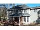 An exterior view of a home, highlighting a deck, porch, and well-manicured yard at 3510 Middlebrook Dr, Durham, NC 27705