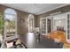 Office boasts natural light from arched windows, complemented by hardwood floors at 3510 Middlebrook Dr, Durham, NC 27705
