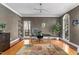 This modern home office features hardwood floors, a sleek desk, and a statement rug at 3510 Middlebrook Dr, Durham, NC 27705