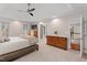 This large main bedroom has neutral walls, a ceiling fan, and carpet flooring at 3510 Middlebrook Dr, Durham, NC 27705