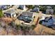 Aerial view of a lovely home and its backyard featuring mature trees and a patio at 5025 Fanyon Way, Raleigh, NC 27612