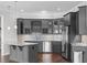 Stylish wet bar area with granite counters, stainless steel appliances and modern cabinets at 5025 Fanyon Way, Raleigh, NC 27612