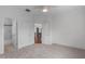 Bright bedroom with neutral walls, carpet, ceiling fan and a view to the home's second floor at 5025 Fanyon Way, Raleigh, NC 27612