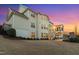 Expansive backyard at dusk featuring a multi-story home with a screened-in porch at 5025 Fanyon Way, Raleigh, NC 27612