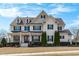 Stunning two-story home with beautiful landscaping, black shutters and a covered front porch at 5025 Fanyon Way, Raleigh, NC 27612