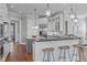 Modern kitchen with a large island, stainless steel appliances, and a breakfast bar at 5025 Fanyon Way, Raleigh, NC 27612