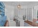 Well-lit home office features modern decor, custom shelving, and elegant French doors at 5025 Fanyon Way, Raleigh, NC 27612