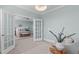 A sitting room with french doors offers views to the bedroom at 5025 Fanyon Way, Raleigh, NC 27612