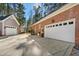 Spacious two-car garage with ample driveway parking and a well-manicured exterior at 5300 Grand Gate Dr, Raleigh, NC 27613
