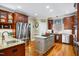 Open kitchen with stainless steel appliances, center island, and ample cabinet space at 5300 Grand Gate Dr, Raleigh, NC 27613