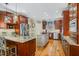 Gourmet kitchen featuring stainless steel appliances, granite countertops, and custom cabinets at 5300 Grand Gate Dr, Raleigh, NC 27613