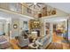 Spacious living room with stone fireplace, hardwood floors, and vaulted ceilings at 5300 Grand Gate Dr, Raleigh, NC 27613