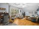 Comfortable living room with hardwood floors, lots of natural light and comfortable seating at 5300 Grand Gate Dr, Raleigh, NC 27613