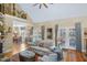 Cozy living room showing hardwood floors, doors to outside and open to dining room at 5300 Grand Gate Dr, Raleigh, NC 27613