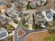 An aerial view of a residential neighborhood featuring houses with manicured lawns and driveways at 543 Guilford Cir, Raleigh, NC 27608