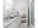 Bathroom with double vanity, marble countertop, and an ensuite bathroom at 543 Guilford Cir, Raleigh, NC 27608