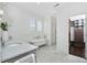 Bright bathroom features a claw foot tub, marble floors, and ample storage at 543 Guilford Cir, Raleigh, NC 27608
