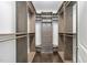Walk-in closet with custom shelving and drawers, providing ample storage space for an organized wardrobe at 543 Guilford Cir, Raleigh, NC 27608