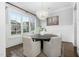 Bright dining room with a view and stylish, modern chandelier at 543 Guilford Cir, Raleigh, NC 27608