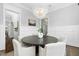 Elegant dining room with a modern chandelier and wainscoting at 543 Guilford Cir, Raleigh, NC 27608