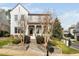 Charming white brick home featuring a welcoming front porch and beautifully landscaped front yard at 543 Guilford Cir, Raleigh, NC 27608