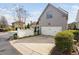 Attached two-car garage with a driveway and well-maintained lawn at 543 Guilford Cir, Raleigh, NC 27608