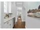 Hallway featuring marble countertops and a view into the dining room at 543 Guilford Cir, Raleigh, NC 27608