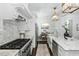 Bright kitchen with stainless steel appliances, marble backsplash, and an island with a sink at 543 Guilford Cir, Raleigh, NC 27608