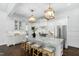 Elegant kitchen featuring marble countertops, stainless steel appliances, and an island with seating at 543 Guilford Cir, Raleigh, NC 27608