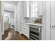 Kitchen with marble countertops, a wine fridge, and stainless steel appliances at 543 Guilford Cir, Raleigh, NC 27608