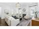 Bright living room with a fireplace, stylish decor, and a modern chandelier at 543 Guilford Cir, Raleigh, NC 27608