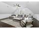 Spacious living room with comfortable seating, bright windows, and a ceiling fan at 543 Guilford Cir, Raleigh, NC 27608