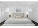 Bright main bedroom features wood floors, trey ceiling, and bright natural light at 543 Guilford Cir, Raleigh, NC 27608