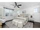 Main bedroom with trey ceiling, bright windows, and stylish decor at 543 Guilford Cir, Raleigh, NC 27608