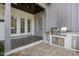 Outdoor kitchen area with a built-in grill and patio space at 543 Guilford Cir, Raleigh, NC 27608