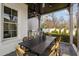 Outdoor kitchen area with a grill and adjacent dining table under cover at 543 Guilford Cir, Raleigh, NC 27608