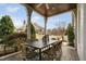 Outdoor patio featuring an outdoor dining table and seating with overhead cover at 543 Guilford Cir, Raleigh, NC 27608
