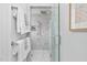 Modern shower with marble tile, rainfall shower head, and glass door for a spa-like experience at 543 Guilford Cir, Raleigh, NC 27608