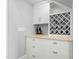 Stylish wine nook featuring granite counters and custom wine rack at 543 Guilford Cir, Raleigh, NC 27608