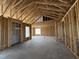 Open framed interior, highlighting the room's structure, soaring ceilings and natural light at 56 Bailey-Boykin Rd, Selma, NC 27576