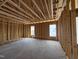 Spacious framed interior showcasing the room's structure, natural light, and potential at 56 Bailey-Boykin Rd, Selma, NC 27576