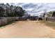 Large backyard space with a wooden fence, patio, and plenty of open space at 6100 Paducah Dr, Raleigh, NC 27610