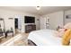 Spacious bedroom with a full-size bed, decorative lighting, and functional furniture at 6100 Paducah Dr, Raleigh, NC 27610