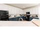 Bright kitchen featuring two-tone cabinets and stainless steel appliances at 6100 Paducah Dr, Raleigh, NC 27610