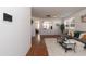Bright and airy living room featuring neutral walls, wood floors, and comfortable seating arrangement at 6100 Paducah Dr, Raleigh, NC 27610