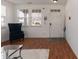 Bright and airy living room with hardwood floors, stylish chair, and plenty of natural light at 6100 Paducah Dr, Raleigh, NC 27610