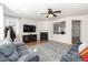 Living room featuring a fireplace, ceiling fan and comfortable seating area at 6100 Paducah Dr, Raleigh, NC 27610