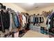 Spacious walk-in closet with ample storage, shelves, and clothing racks at 6100 Paducah Dr, Raleigh, NC 27610